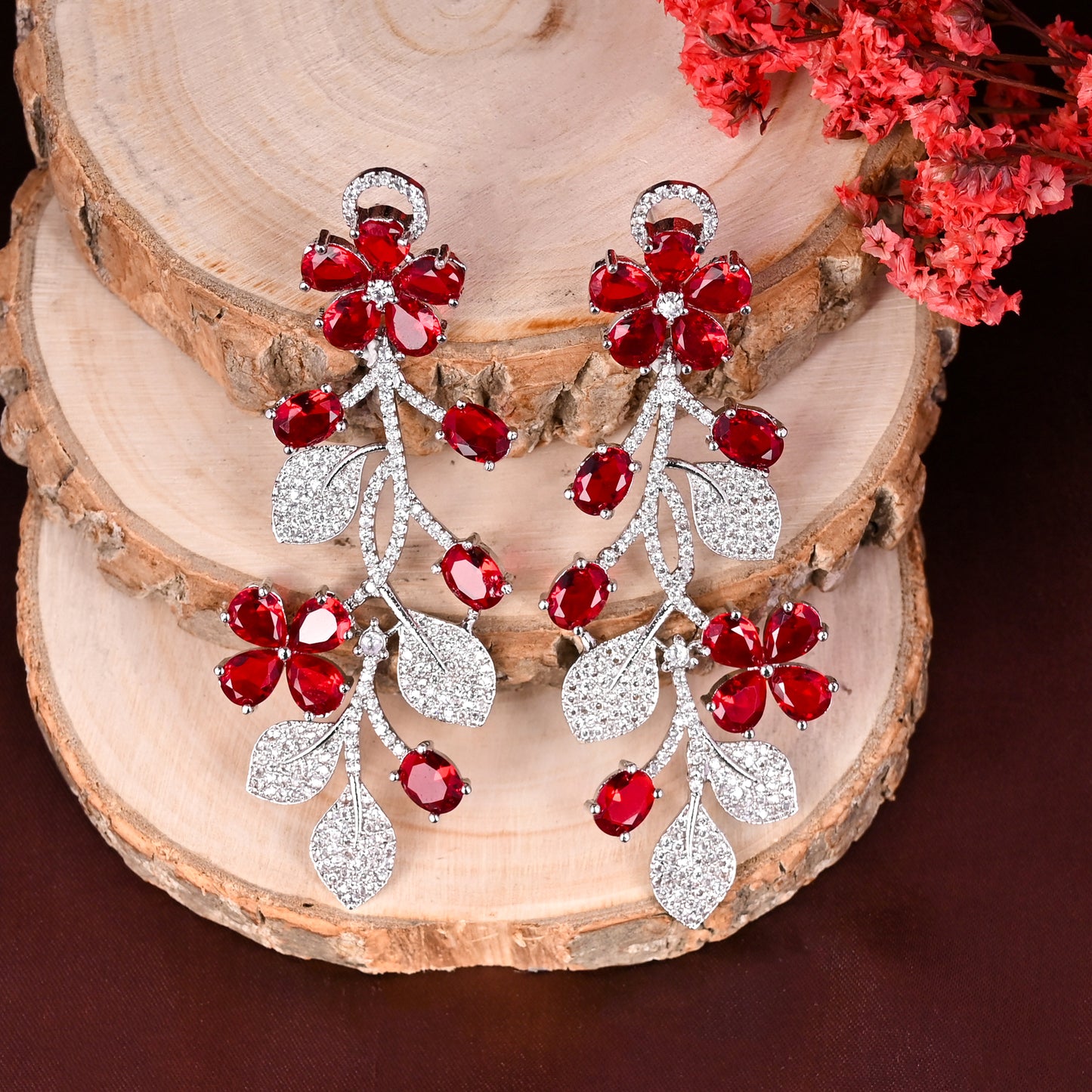 CKLAKART's NOOR Silver Flower Earrings Featuring Ruby Color Stones and Sparkling American Diamonds