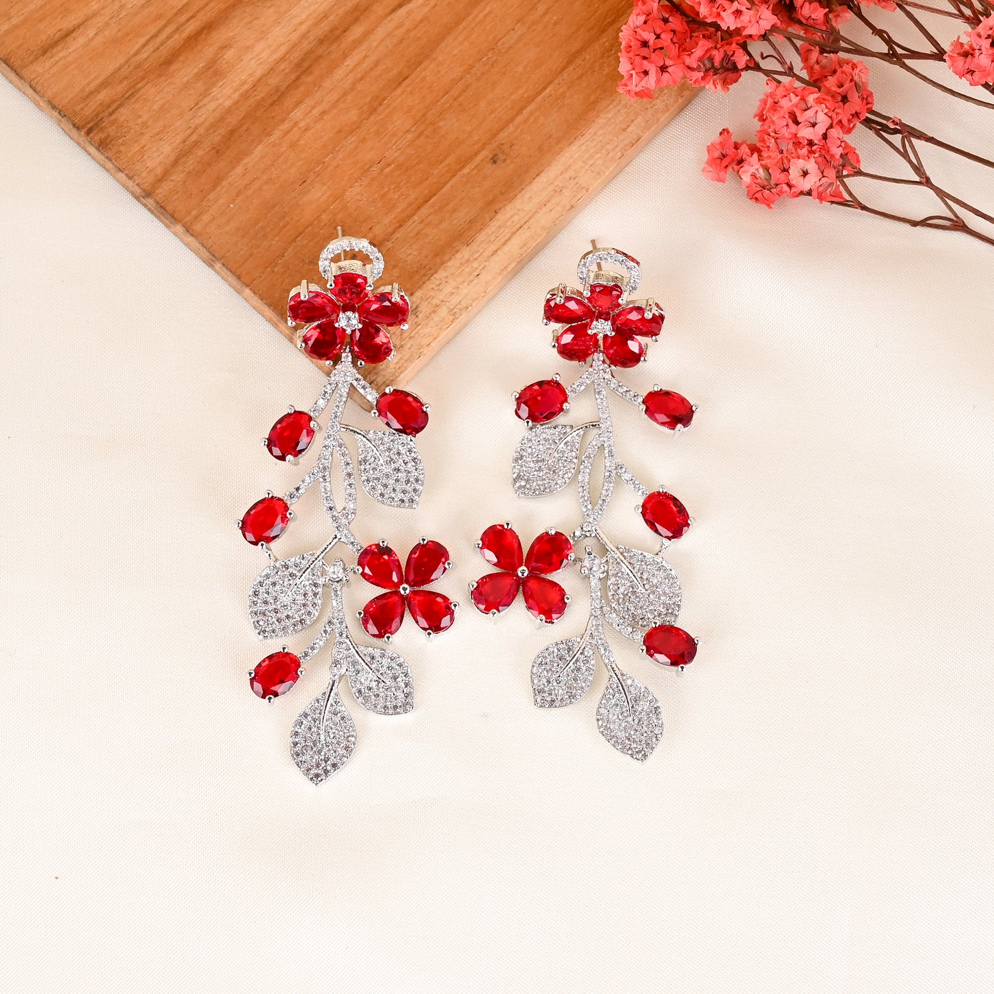 CKLAKART's NOOR Silver Flower Earrings Featuring Ruby Color Stones and Sparkling American Diamonds