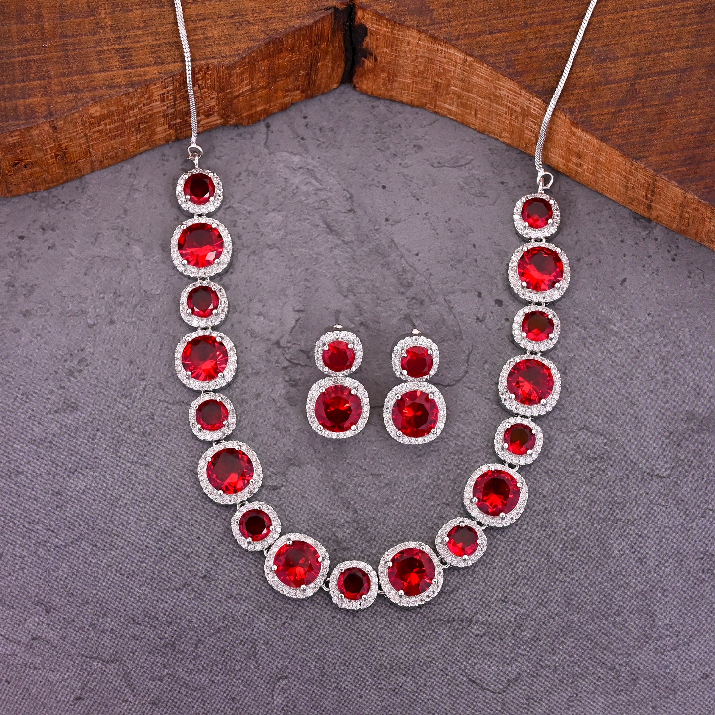 CKLAKART's NOOR Silver-Toned Necklace Set Adorned with Ruby Red Stones and Dazzling American Diamonds