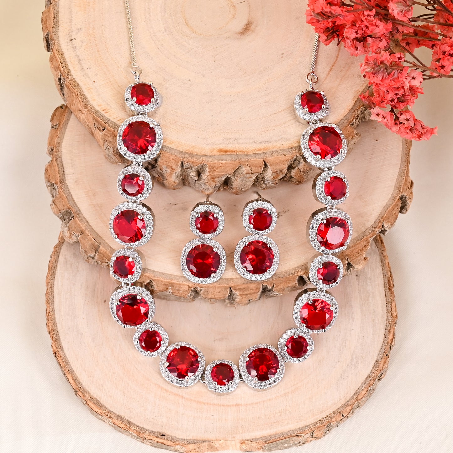 CKLAKART's NOOR Silver-Toned Necklace Set Adorned with Ruby Red Stones and Dazzling American Diamonds