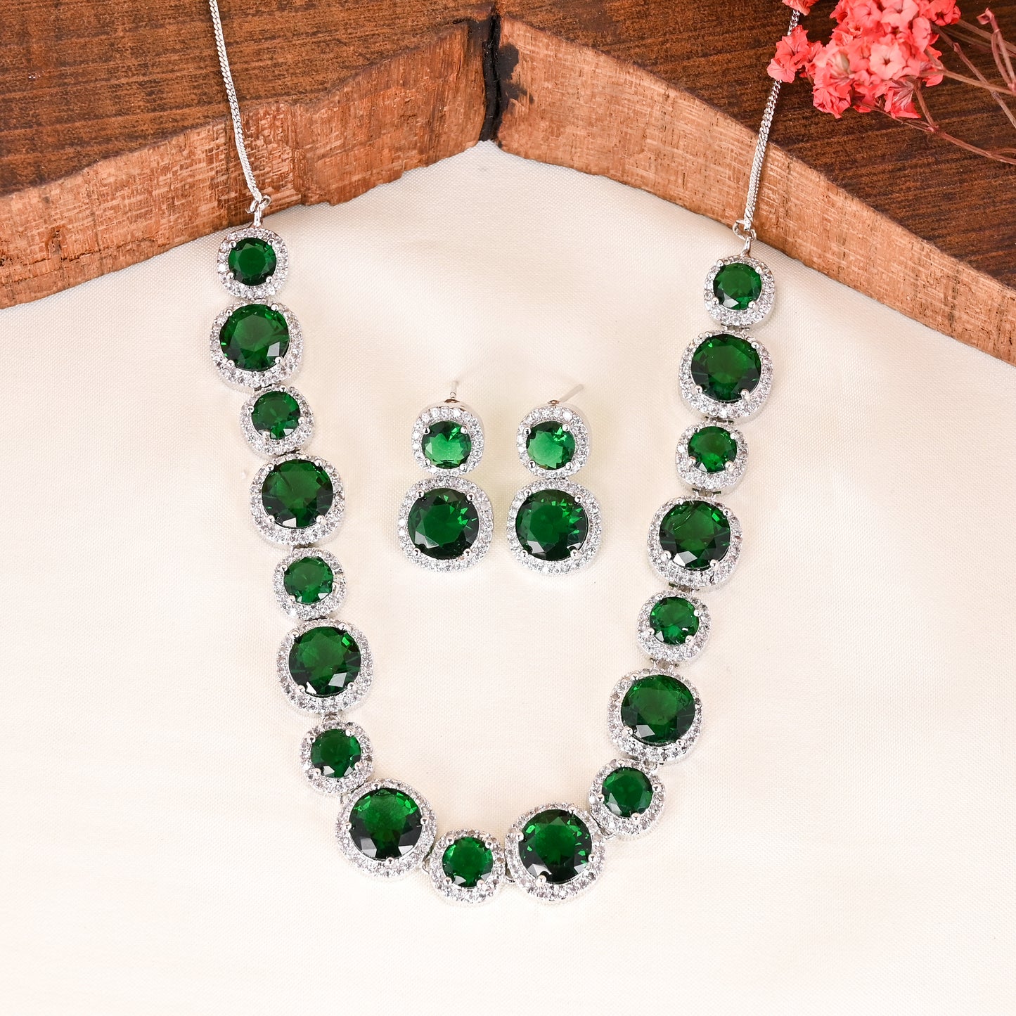 CKLAKART's NOOR Silver-Toned Necklace Set Adorned with Emerald Green Stones and Dazzling American Diamonds