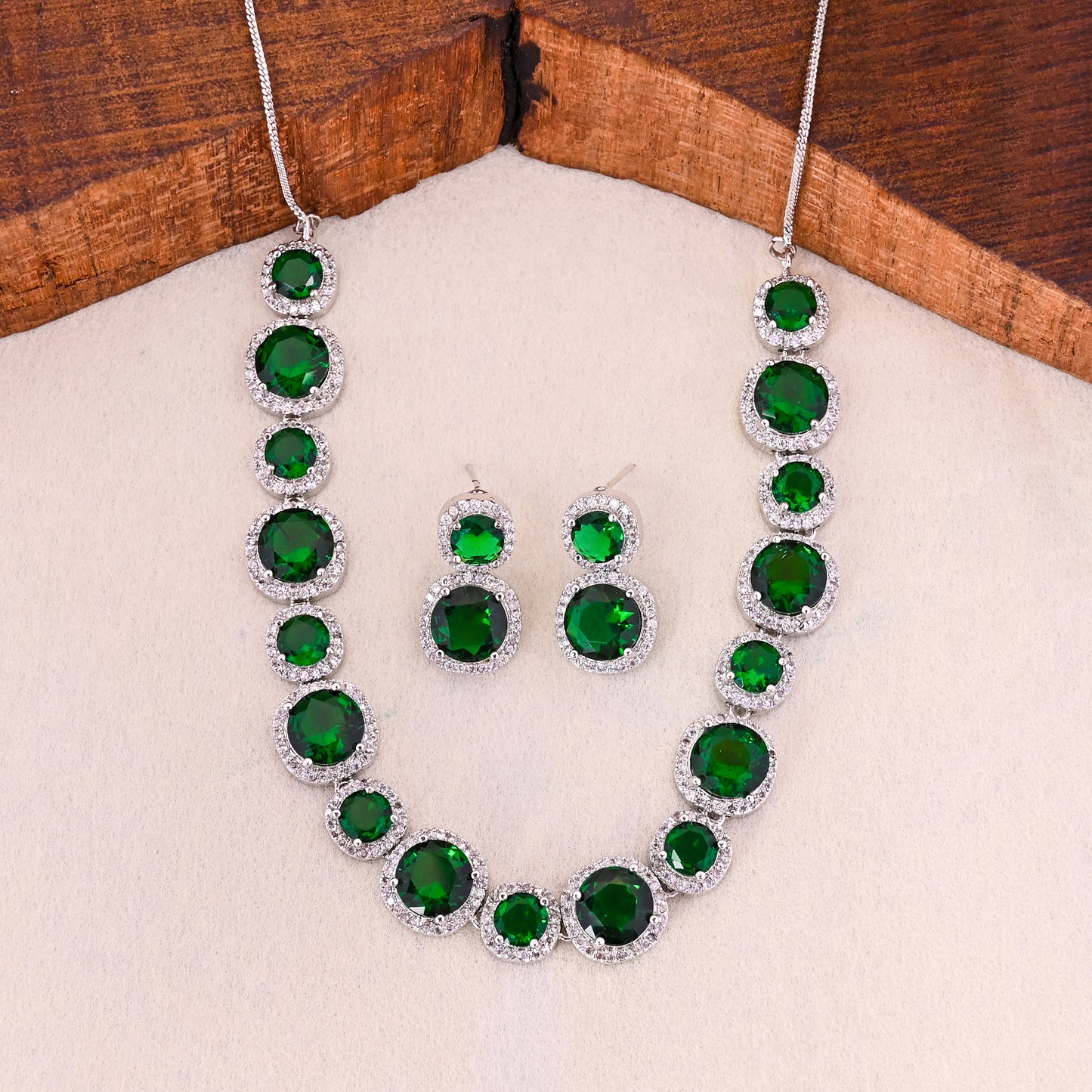 CKLAKART's NOOR Silver-Toned Necklace Set Adorned with Emerald Green Stones and Dazzling American Diamonds