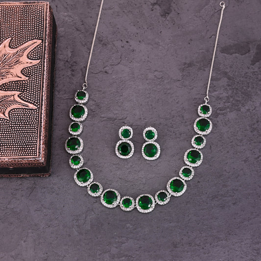 CKLAKART's NOOR Silver-Toned Necklace Set Adorned with Emerald Green Stones and Dazzling American Diamonds