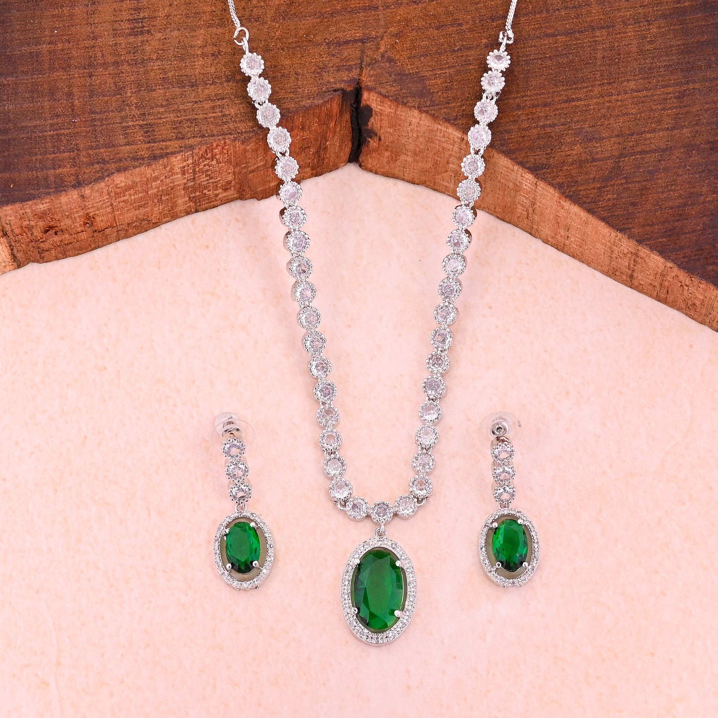 CKLAKART's NOOR Silver-Toned Oval Drop Necklace Set Adorned with Emerald Green Stones and Dazzling American Diamonds