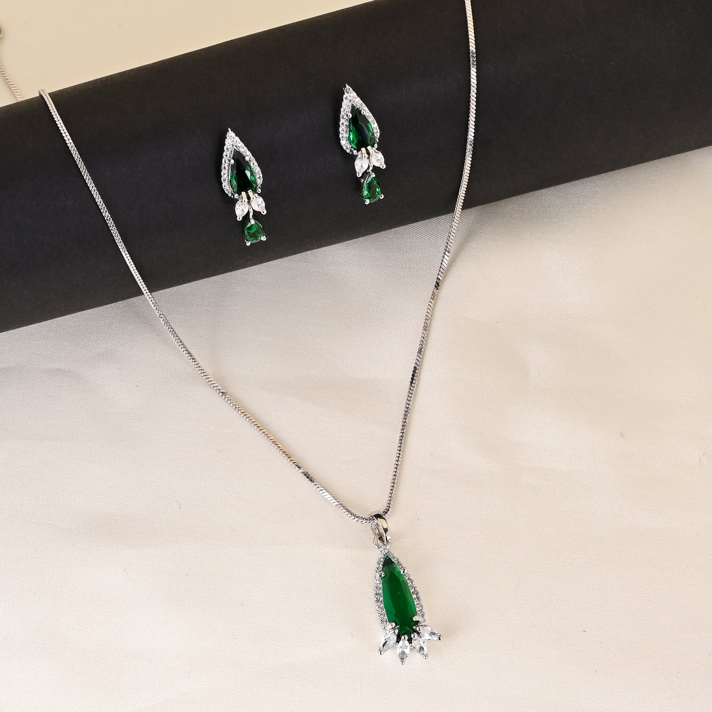 CKLAKART's NOOR Silver Droplet Chain Pendant Set Featuring Emerald Green Stones and Sparkling American Diamonds