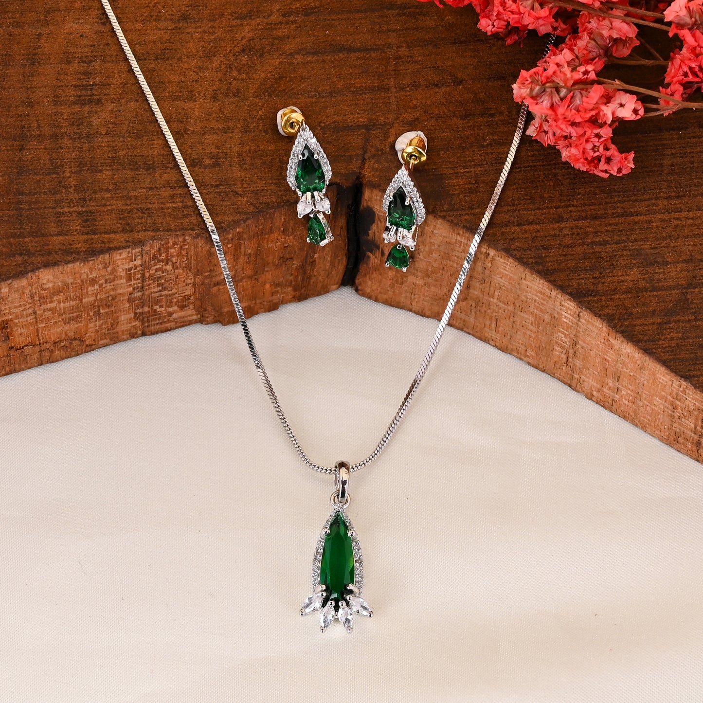 CKLAKART's NOOR Silver Droplet Chain Pendant Set Featuring Emerald Green Stones and Sparkling American Diamonds