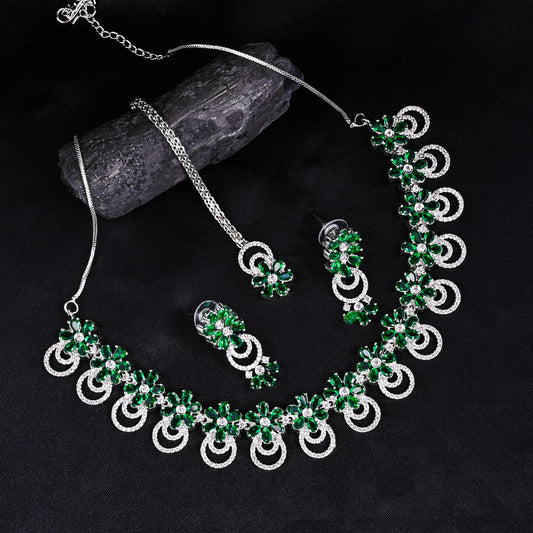 CKLAKART's NOOR Silver-Toned Choker set with Maang Tika Adorned with Emerald Green Stones and Dazzling American Diamonds