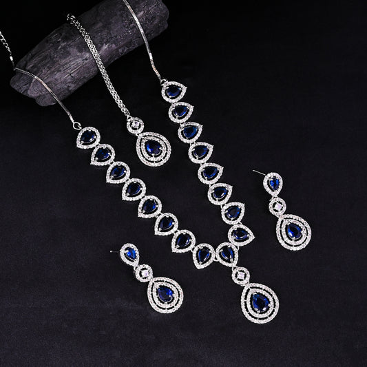 CKLAKART's NOOR Silver-Toned Necklace and Maang Tika Set Adorned with Sapphire Blue Stones and Dazzling American Diamonds