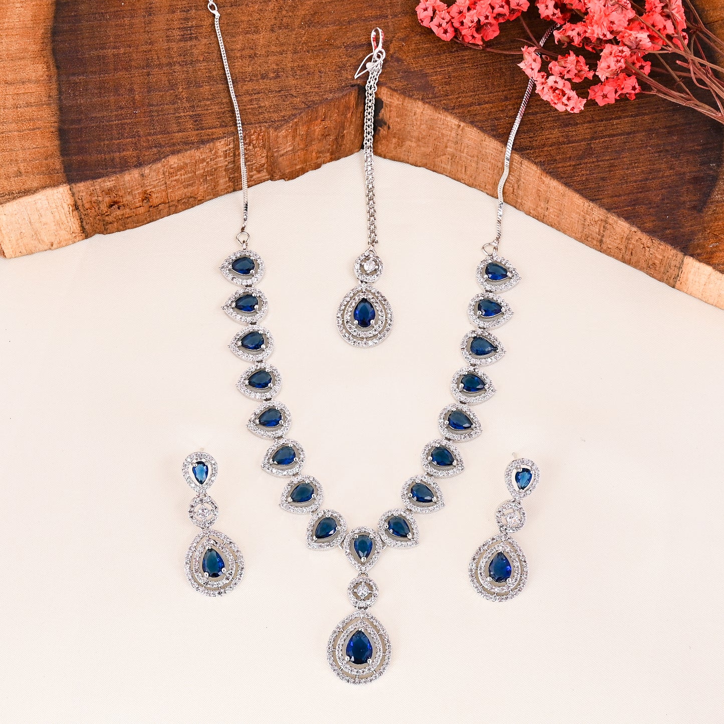 CKLAKART's NOOR Silver-Toned Necklace and Maang Tika Set Adorned with Sapphire Blue Stones and Dazzling American Diamonds