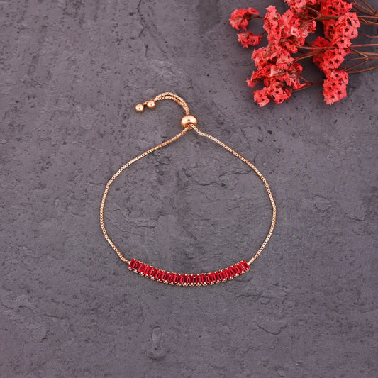 CKLAKART's Gold Toned Bracelet Adorned with Dazzling Ruby Red Stones