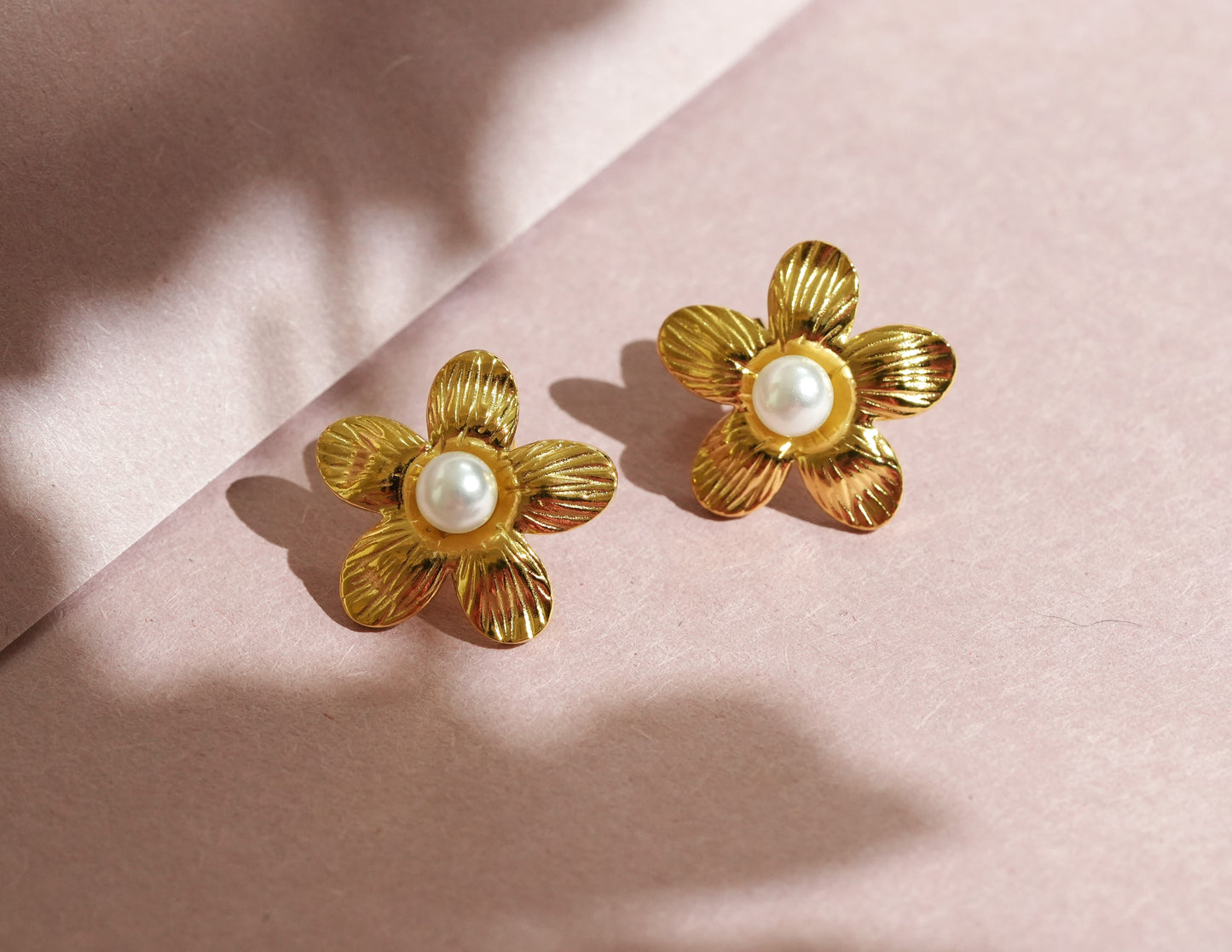 CKLAKART's Flower-Shaped Earrings with White Pearls in Gold Tone