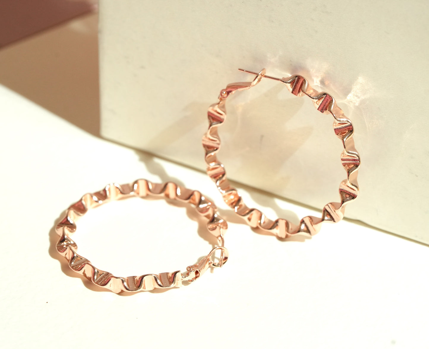 CKLAKART's Curly Chic Big Hoop Earrings in Rose Gold