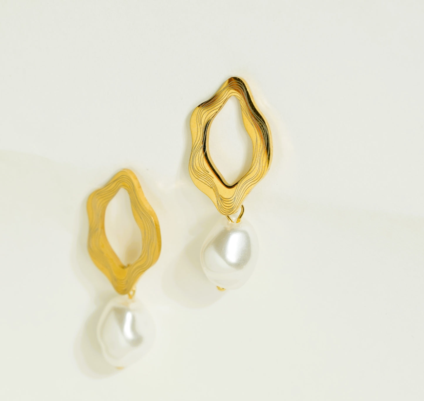 CKLAKART's Gold-Toned Hoop Earrings with Pearl Drops