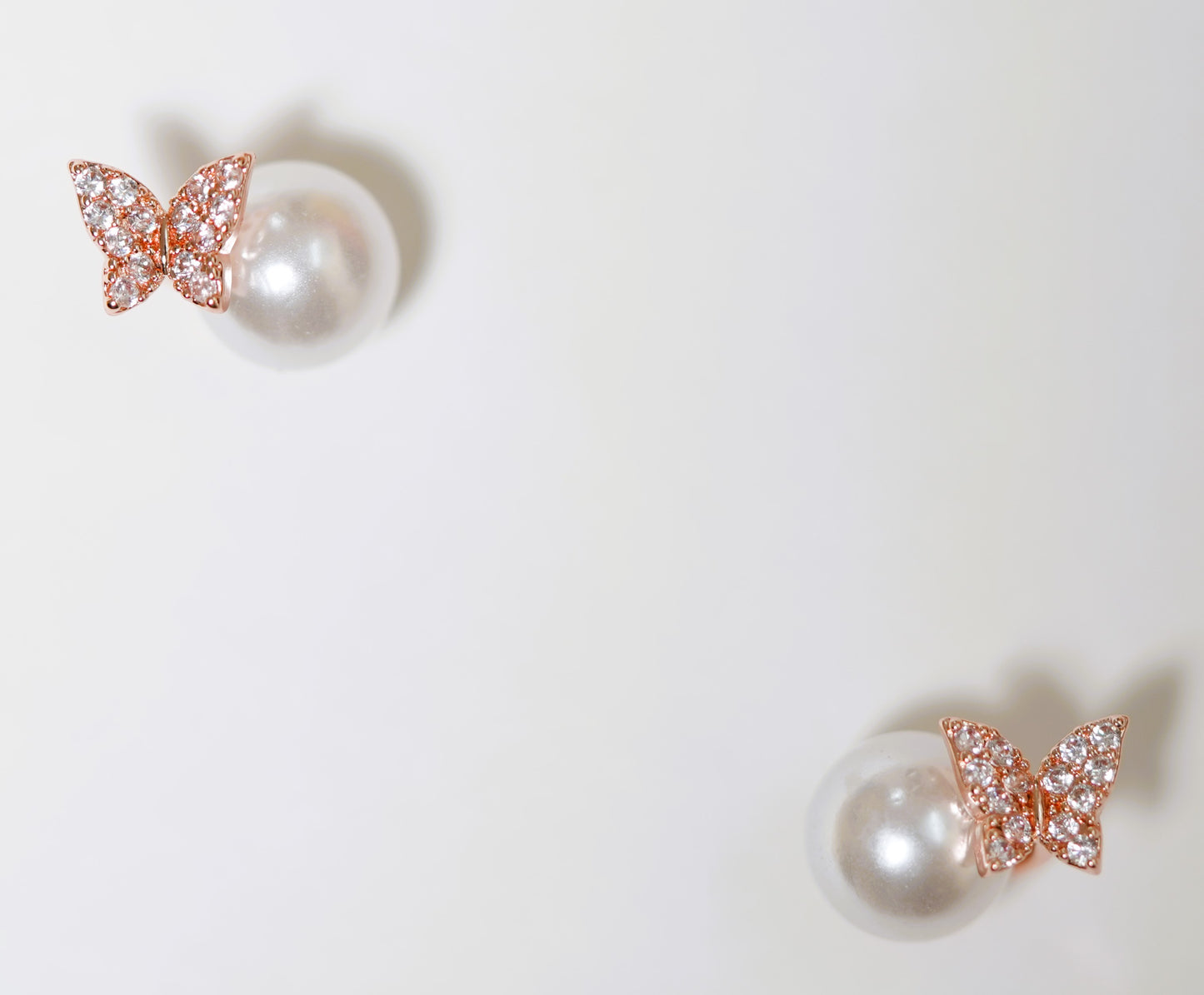 CKLAKART's Pearl Winged Whispers Butterfly Earrings with Zircon Accents